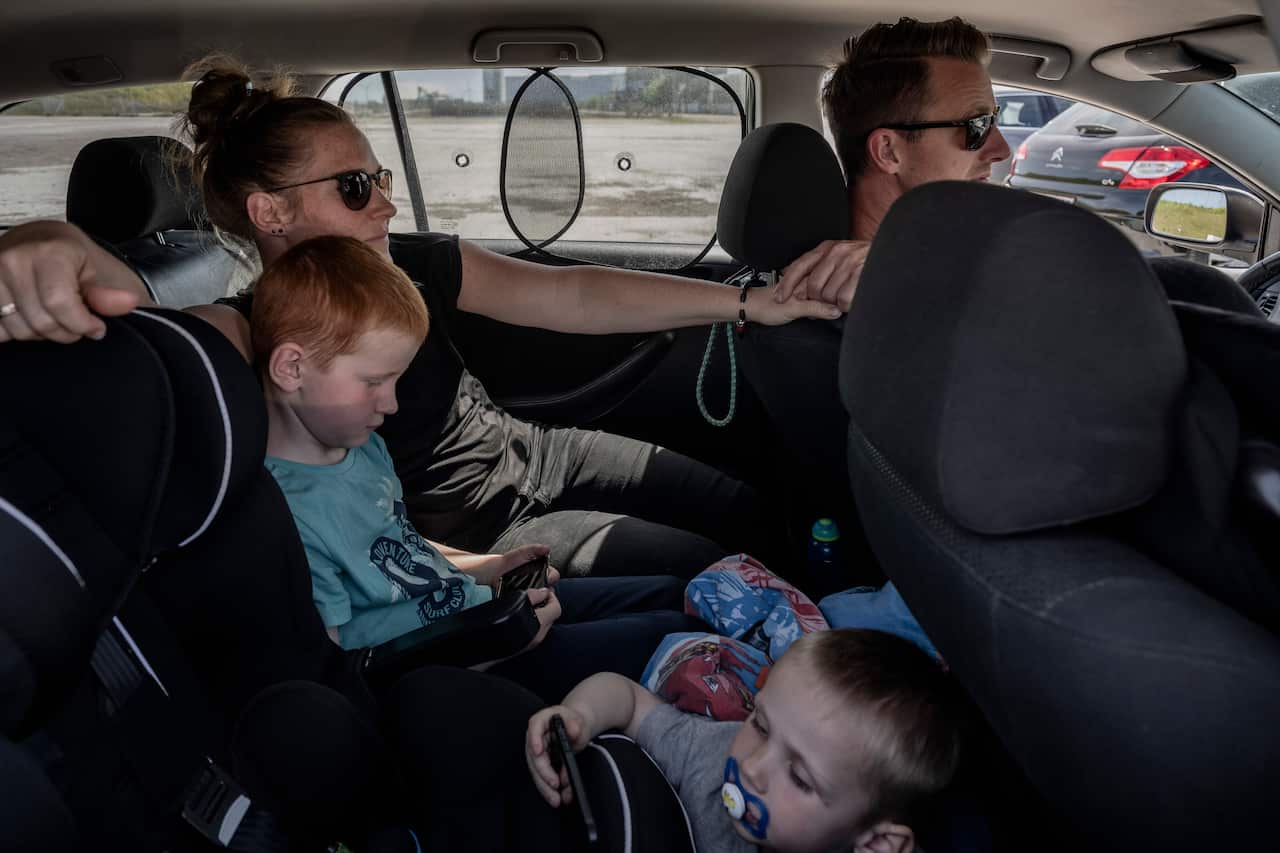 Per Jonsson attends a drive-in church with his family at an industrial wasteland in eastern Copenhagen, May 31, 2020.