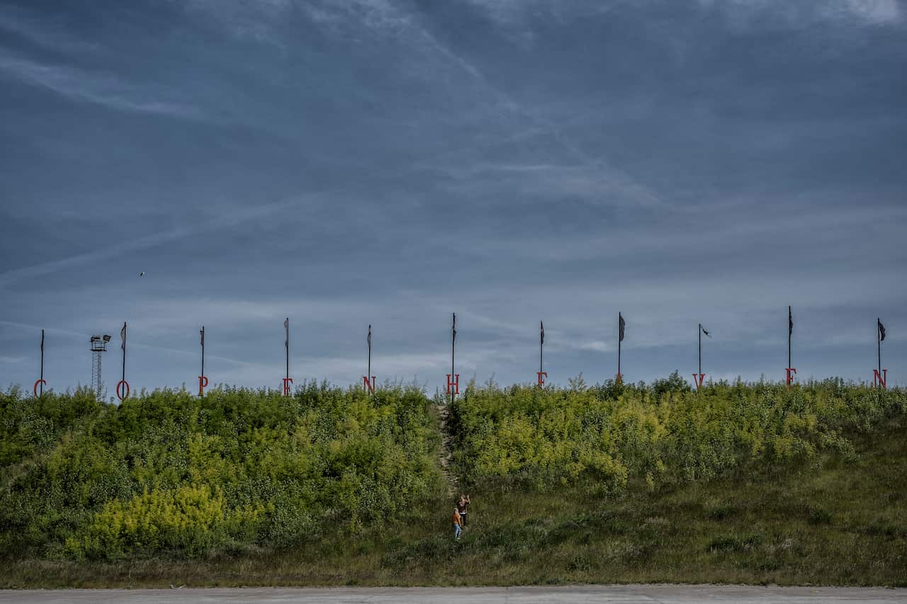 A sign for a site now nicknamed 'Copenheaven,' where a drive-in church meets, eastern Copenhagen, May 31, 2020.
