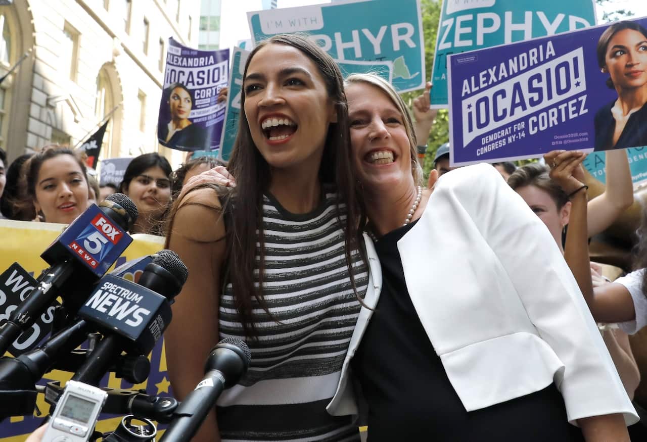 New York City congressional nominee Alexandria Ocasio-Cortez (L) embraces Zephyr Teachout (R), candidate for New York State attorney general