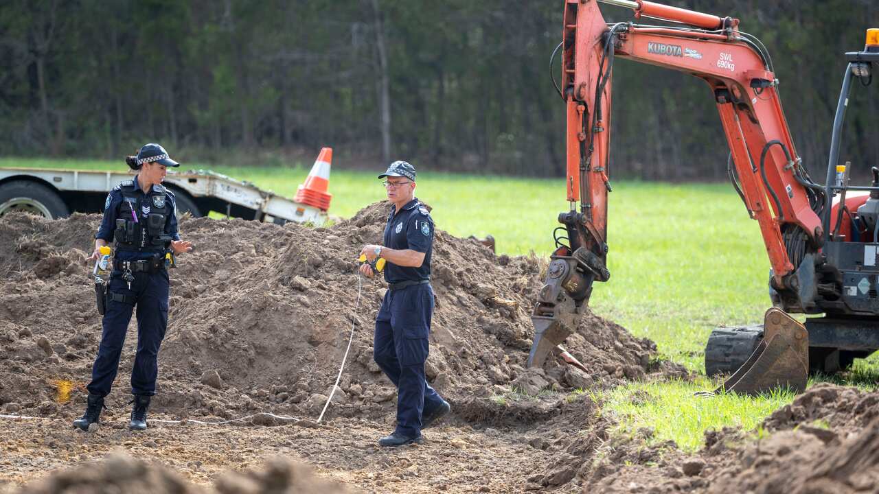 Police are seen scouring dug up earth near Morayfield road in Burpengary, north of Brisbane.