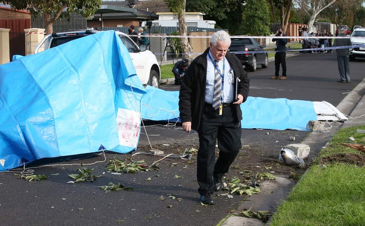Australian Transport Safety Bureau investigators at the scene of a wreckage of a light plane in Scarlet Street, Mordialloc in Melbourne.