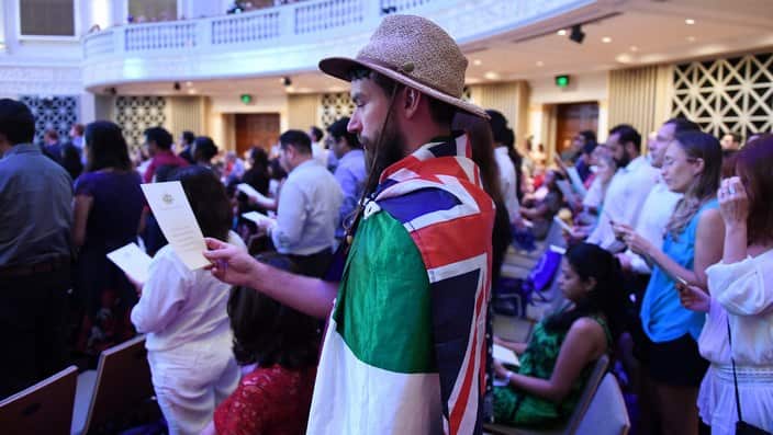 Australian citizenship recipients and their guests attend a citizenship ceremony on Australia Day in Brisbane, Thursday, Jan. 26, 2017. (AAP Image/Dan Peled) NO ARCHIVING
