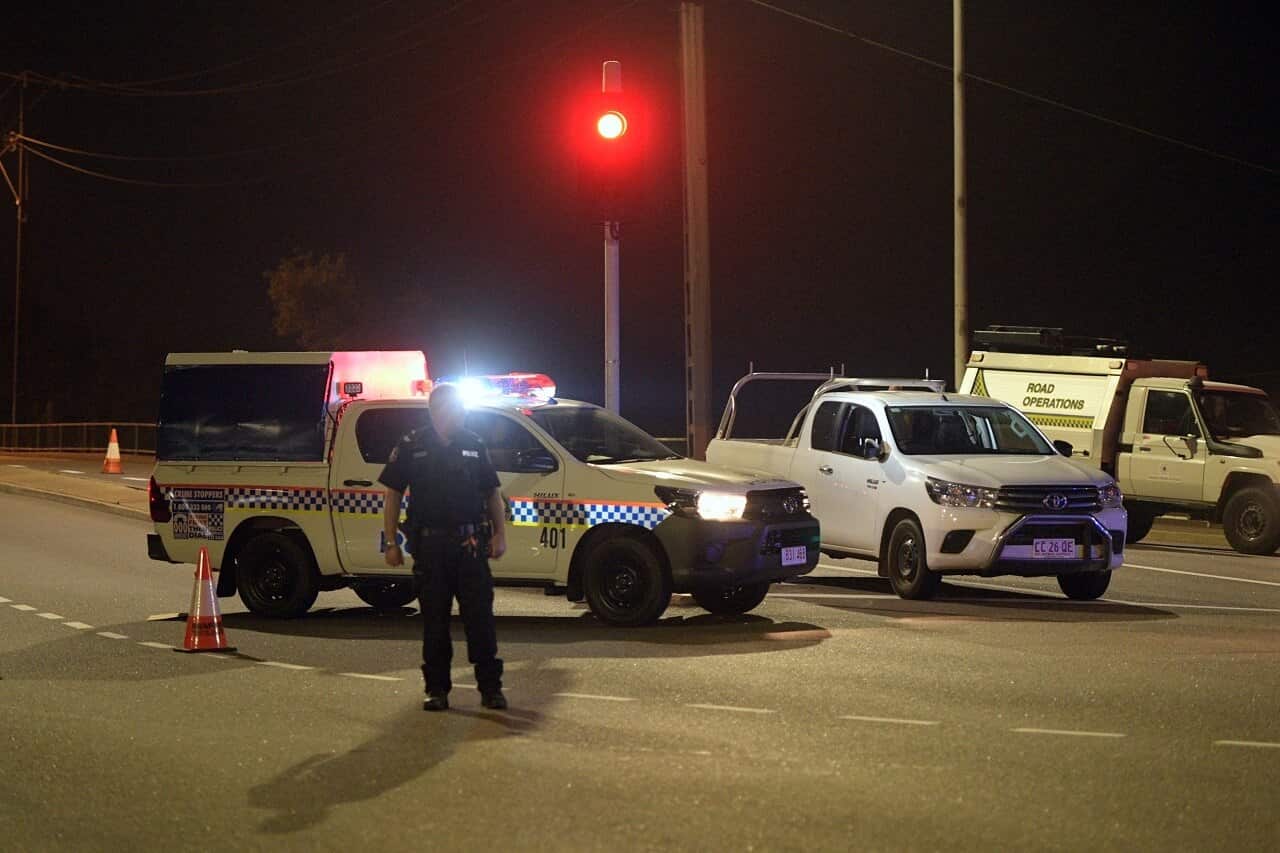 Police at a crime scene on the intersection of McMinn Street and Stuart Highway in Darwin