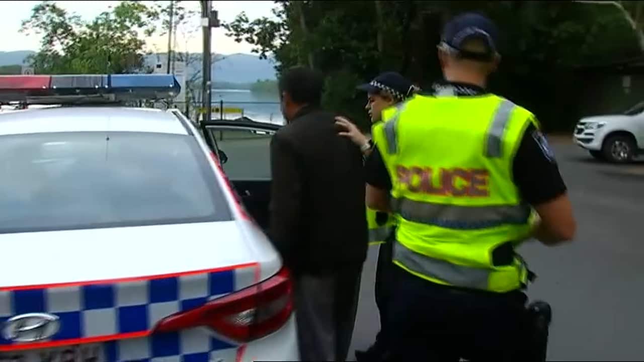 A man is arrested by Queensland Police.