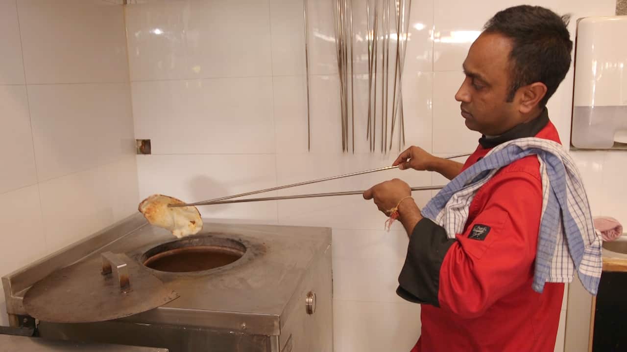 Head Chef Raman Nakul prepares the signature gluten-free naan.