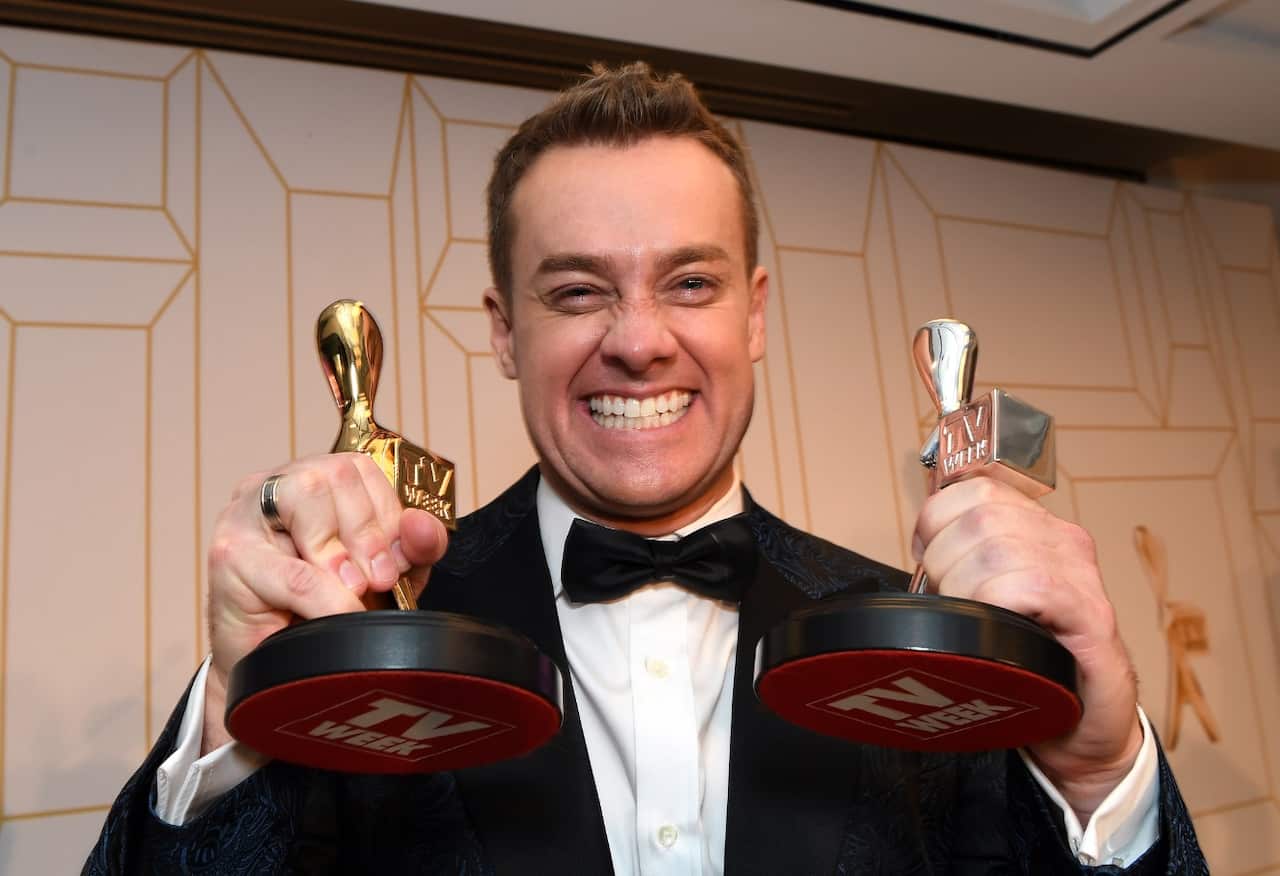 Grant Denyer, presenter of Family Feud, poses with his Gold Logie award (left) at the 2018 Logie Awards at The Star Casino on the Gold Coast,