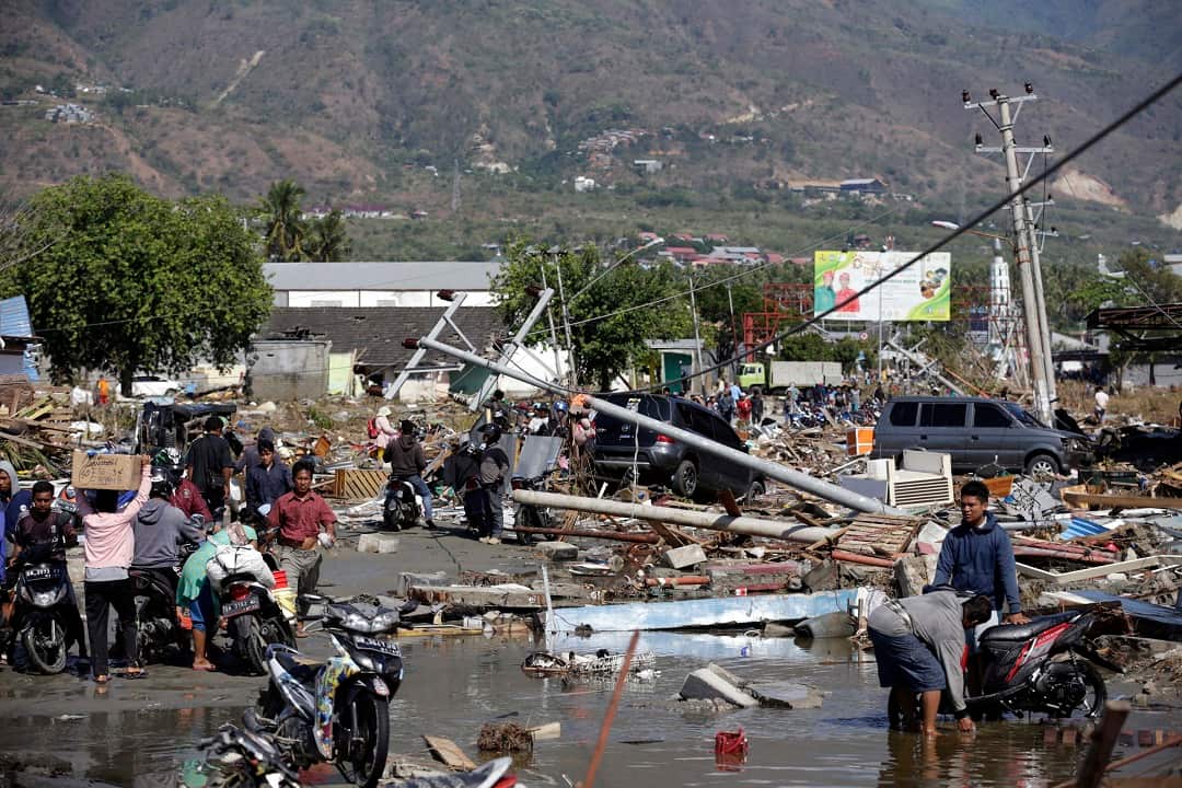 The death toll has almost doubled as search and rescue teams comb the rubble. 