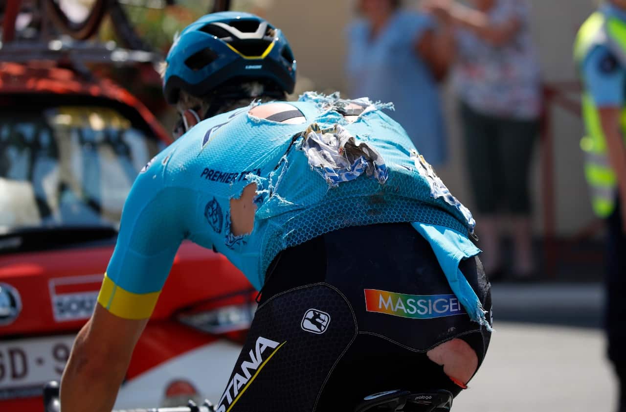 Astana Pro Team rider Michael Valgren Andersen of Denmark in action after crashing during the 9th stage.