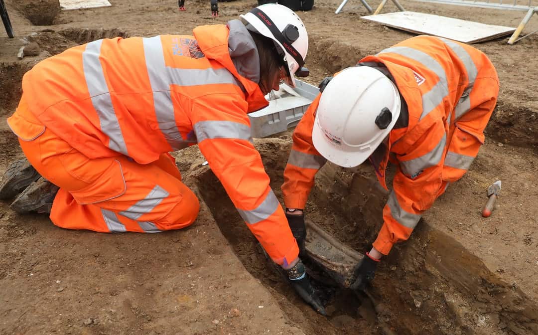 Archaeologists remove the breast plate of Captain Matthew Flinders.