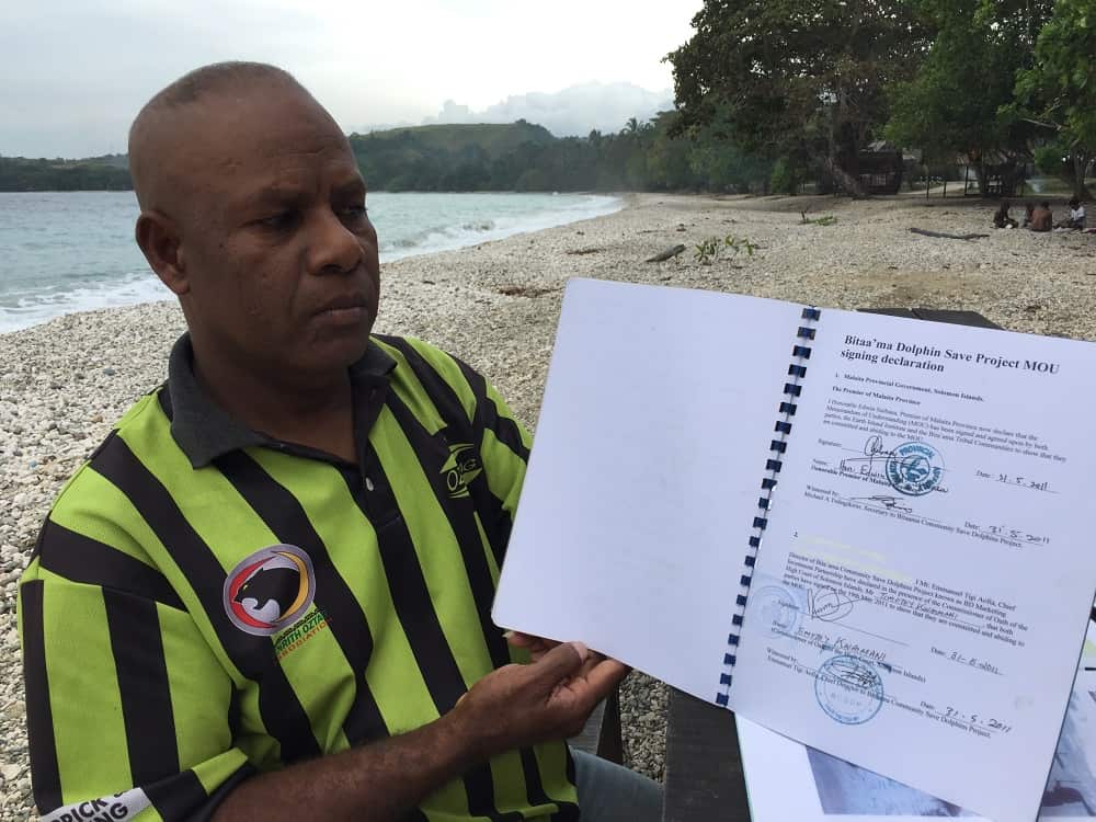 Tigi Emmanuel with agreement to end dolphin kills.