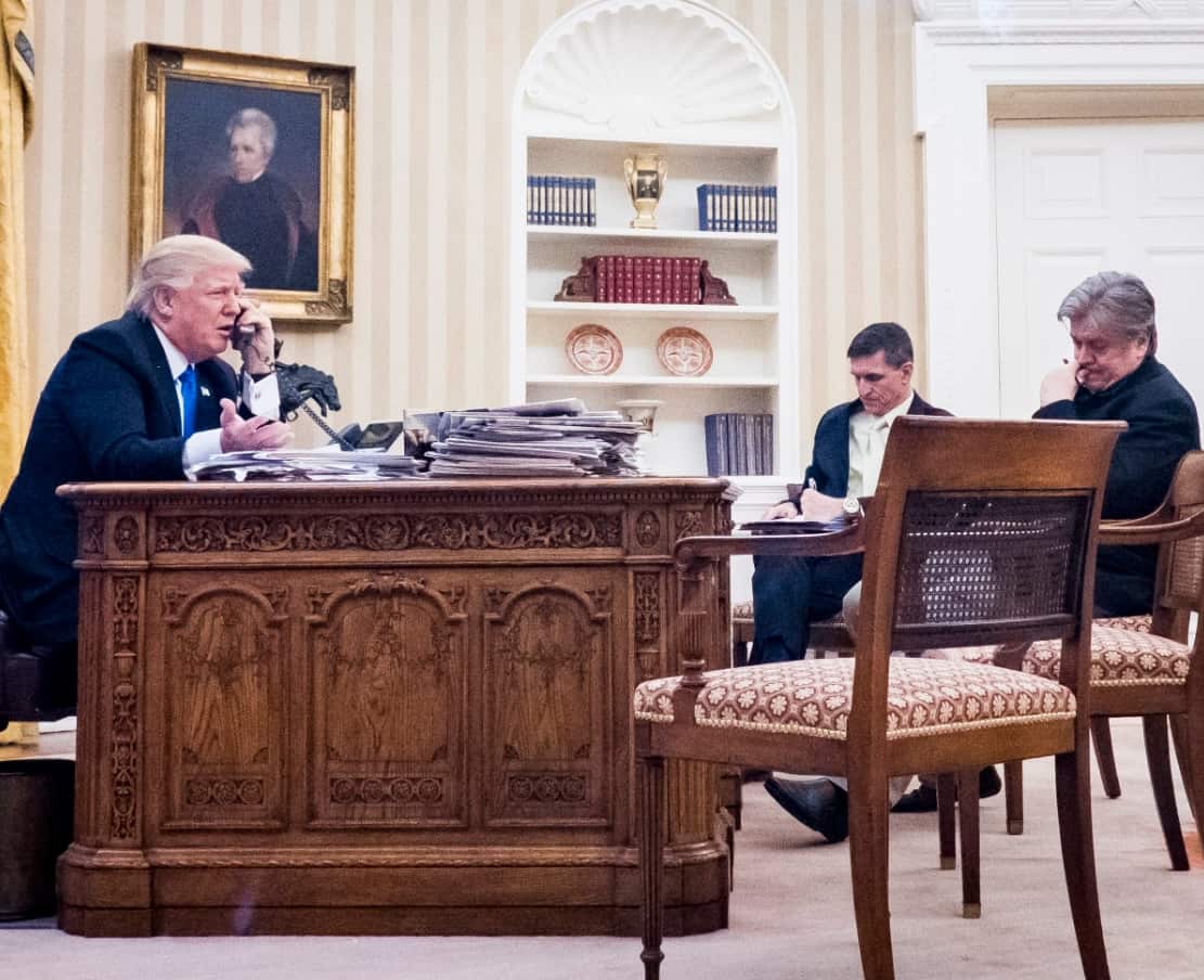 Then senior aide to the president, Steve Bannon (R) and US President Donald Trump (L) on January 28 2016