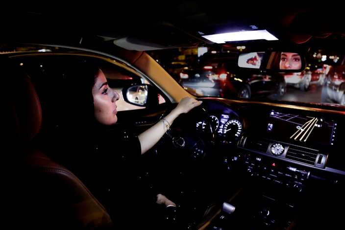 Hessah al-Ajaji drivers her car down the capital's busy Tahlia Street after midnight for the first time in Riyadh, Saudi Arabia.