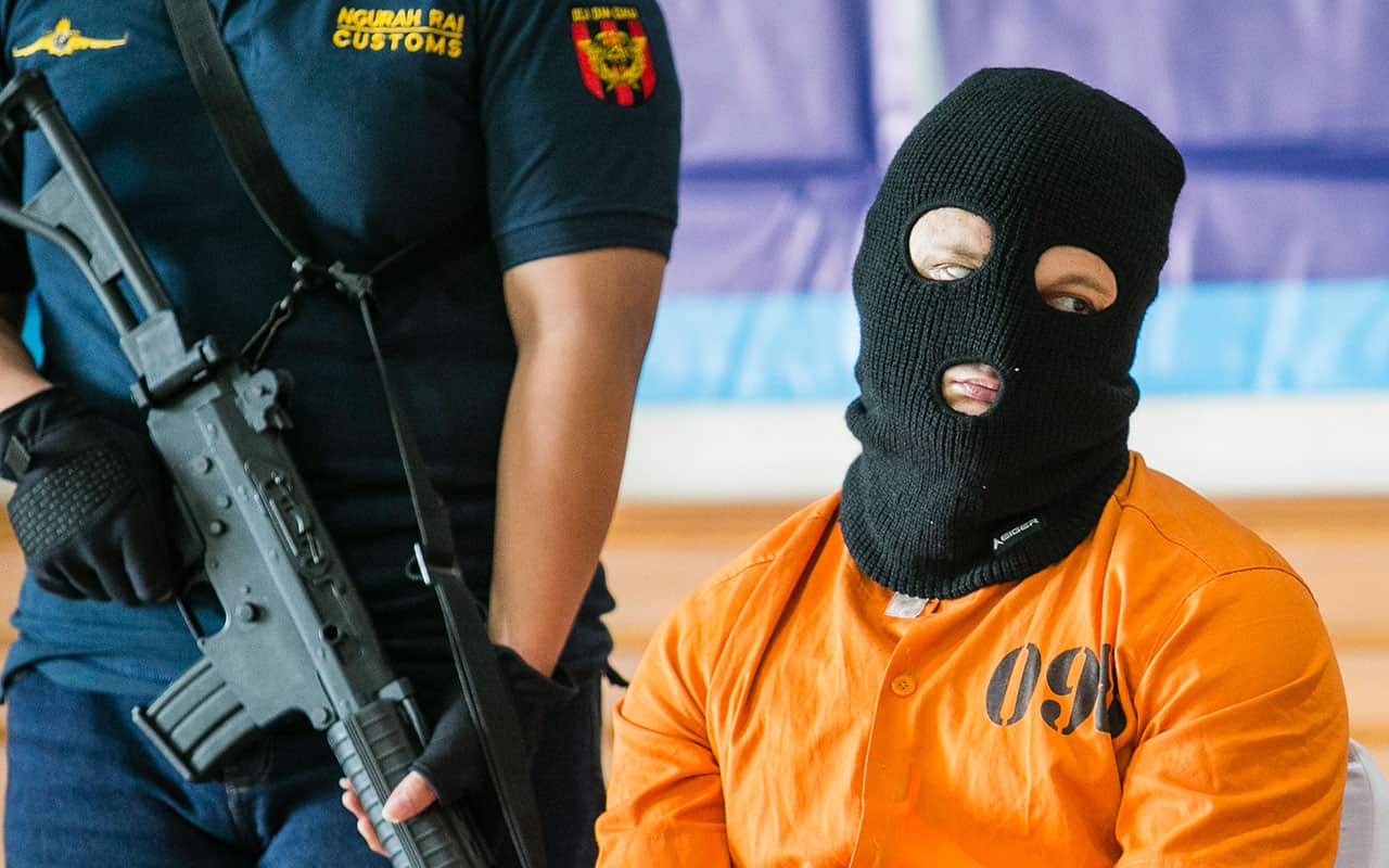 An Australian man is escorted by custom officers in Bali, Indonesia, 19 December 2017.