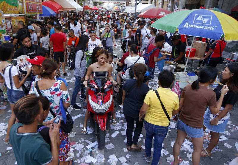 Election campaign materials litter the street as the country's midterm elections draw to a close.