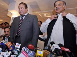 Former Pakistani prime minister Nawaz Sharif (left) and his brother Shahbaz Sharif (right). Shahbaz Sharif has rejected claims Khan has pulled away.