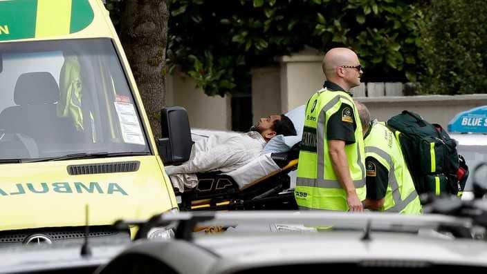  Ambulance staff take a man from outside a mosque in central Christchurch, New Zealand, Friday, March 15, 2019. A witness says many people have been killed in a mass shooting at a mosque in the New Zealand city of Christchurch.
