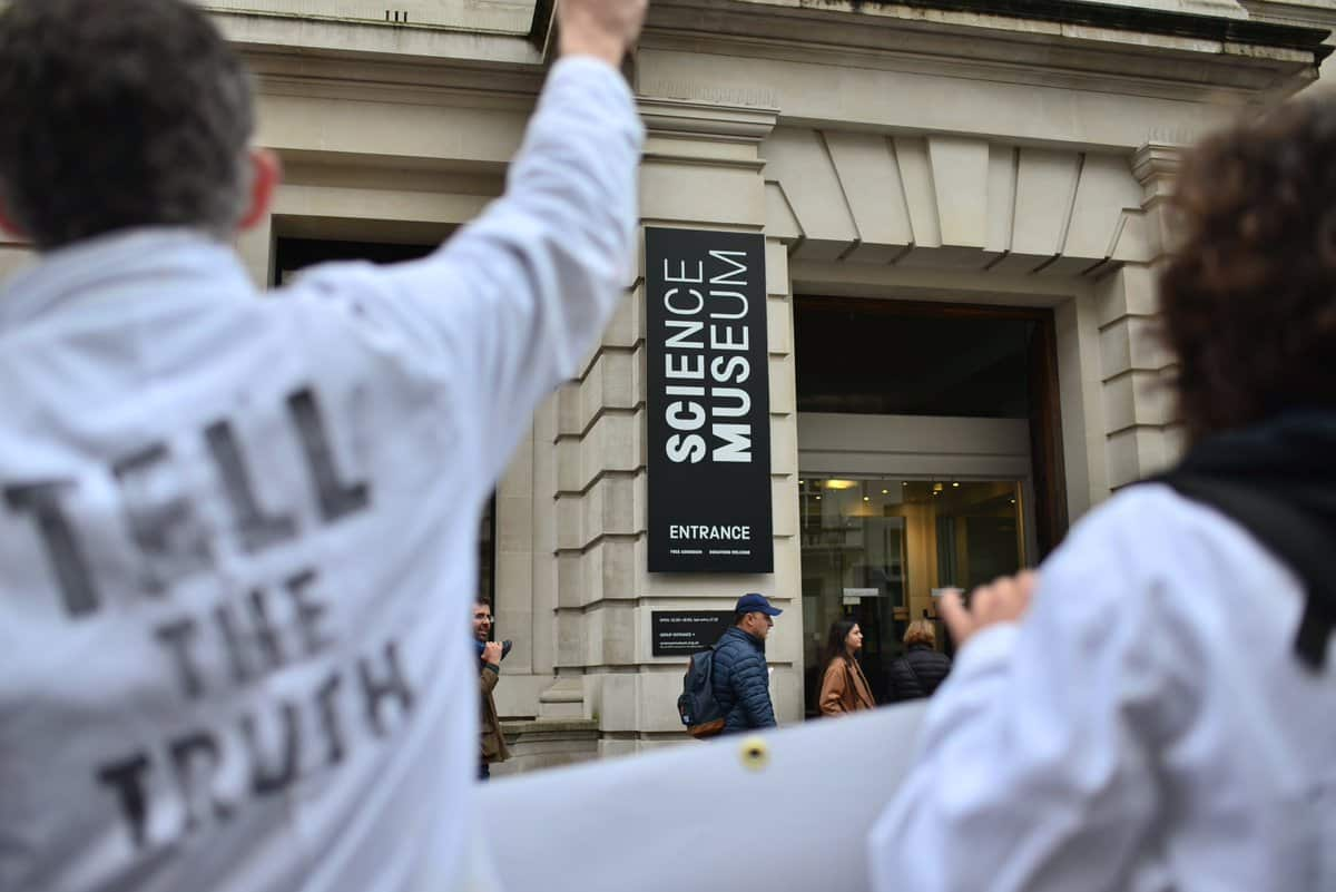 Wearing white laboratory coats to symbolise their research credentials, a group of about 20 of the signatories gathered outside London's Science Museum.