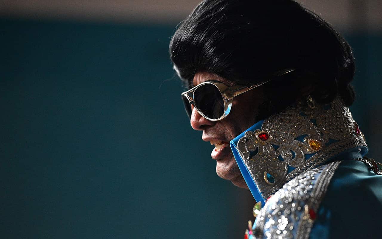 An Elvis impersonator is seen before boarding the Elvis Express at Central Station in Sydney, Thursday, January 11, 2018. 