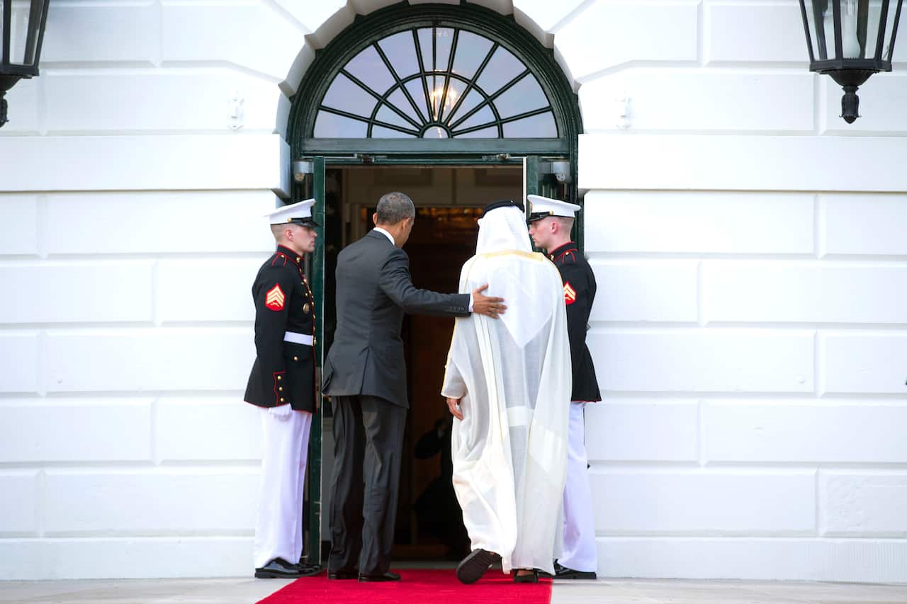 President Barack Obama walks with Prince Mohammed bin Zayed, outside the White House in Washington.