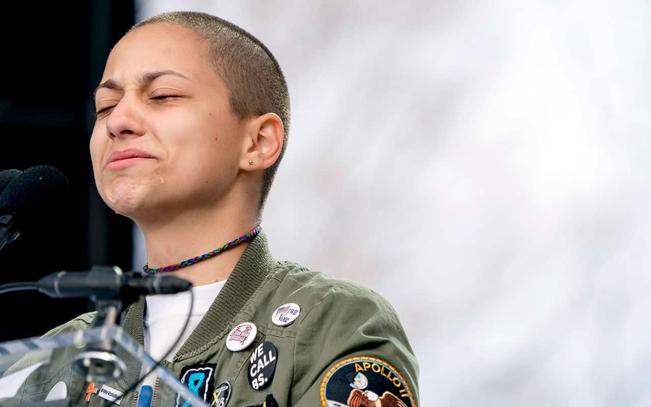 Emma Gonzalez, a survivor of the mass shooting at Marjory Stoneman Douglas High School closes her eyes and cries as she stands silently at the podium.