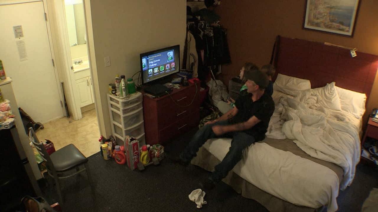 David shares the small hotel room with his children on weekends.