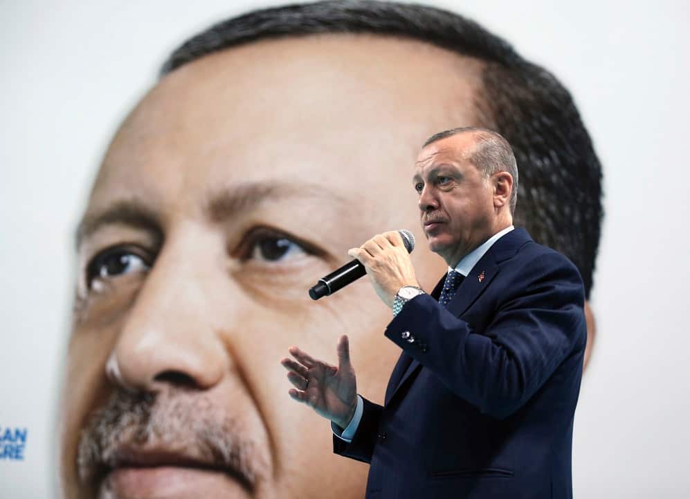 Turkey's President and leader of ruling Justice and Development Party Recep Tayyip Erdogan addresses his supporters in Duzce, Turkey, Sunday, Dec. 31, 2017.(Yasin Bulbul/Pool Photo via AP)