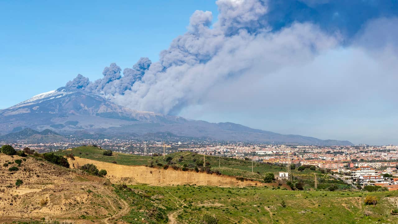 A smoke column comes out of the Etna volcano in Catania, Italy.