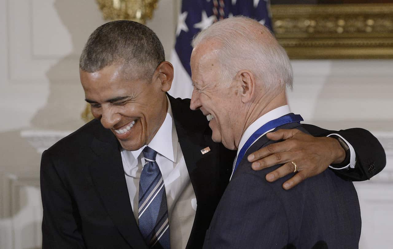 Former US President Barack Obama (R) presents the Medal of Freedom to Vice-President Joe Biden in White House, January 2017