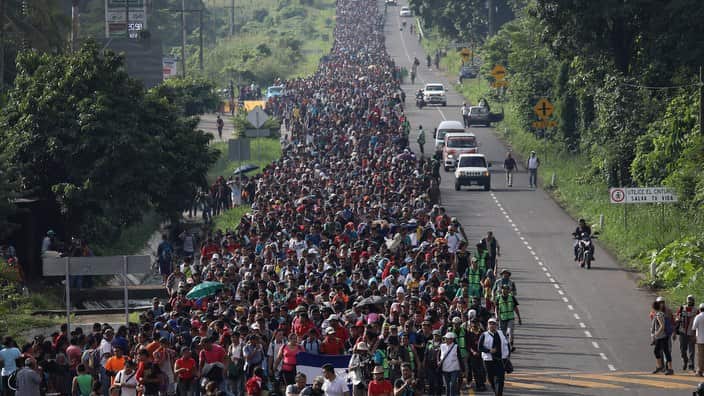Masses of migrants moving towards the US border.
