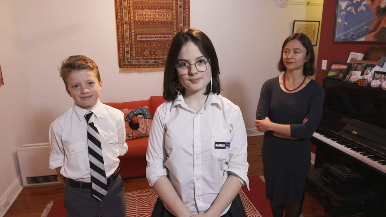 Daisy and her younger brother Leo and mum, Annabel. The whole family will be striking on Friday.