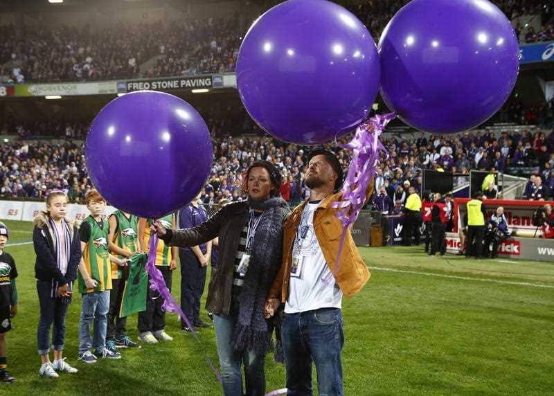 Rin Norris and Anthony Maslin elease balloons in a tribute to their children in 2014.
