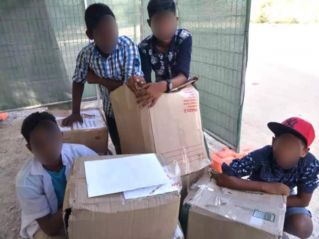 Children on Nauru with some of the parcels. 