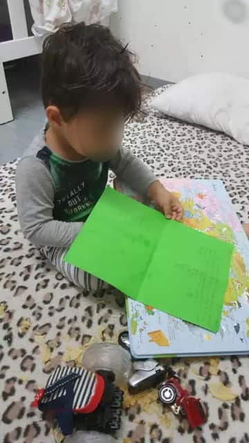 A child opens a parcel.