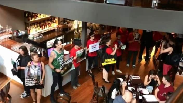 Protesters crash a Melbourne steakhouse.
