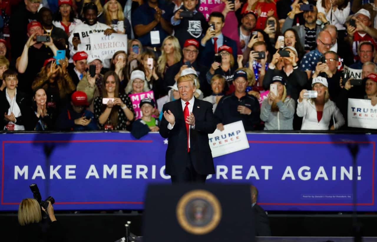 US President Donald Trump arrives at a campaign rally in Washington Township, Mich., Saturday, April 28, 2018.