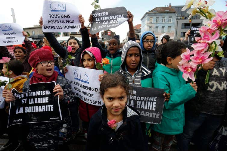 vChildren from Molenbeek hold placards during a march against terror in Brussels, Belgium, April 17 2016.Children from Molenbeek hold placards during a march against terror in Brussels, Belgium, April 17 2016.