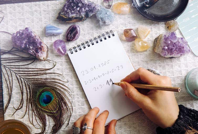 A woman calculates a destiny number based on numerology.