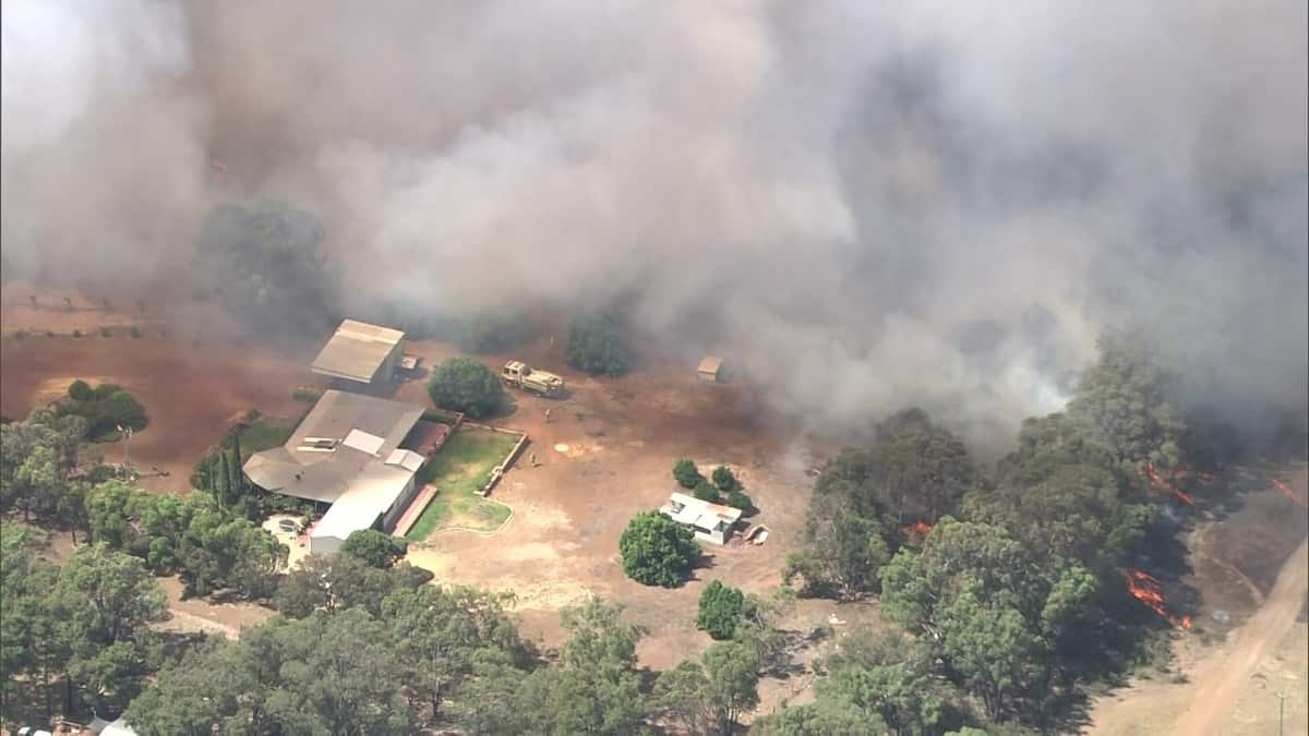 Parts of the Western Australian capital are being engulfed in smoke as bushfires rage near homes.