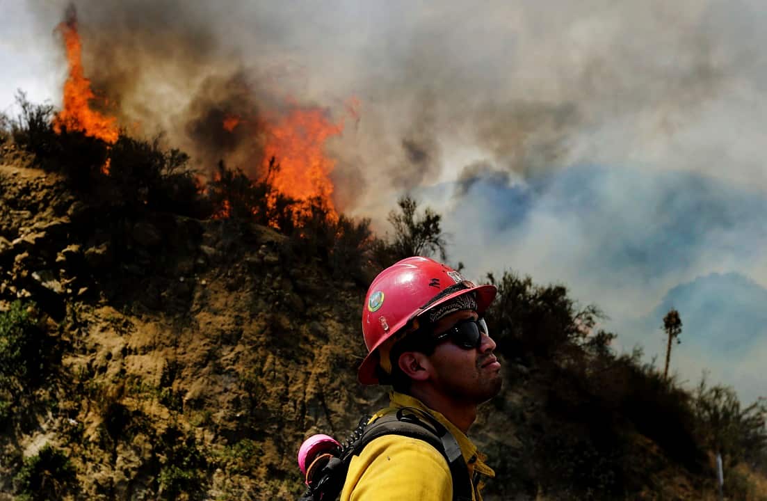 A firefighter watches as the Cranston fire grows to more 1,200 acres in the San Bernardino National Forest above Hemet.A firefighter watches as the Cranston fire grows to more 1,200 acres in the San Bernardino National Forest above Hemet.