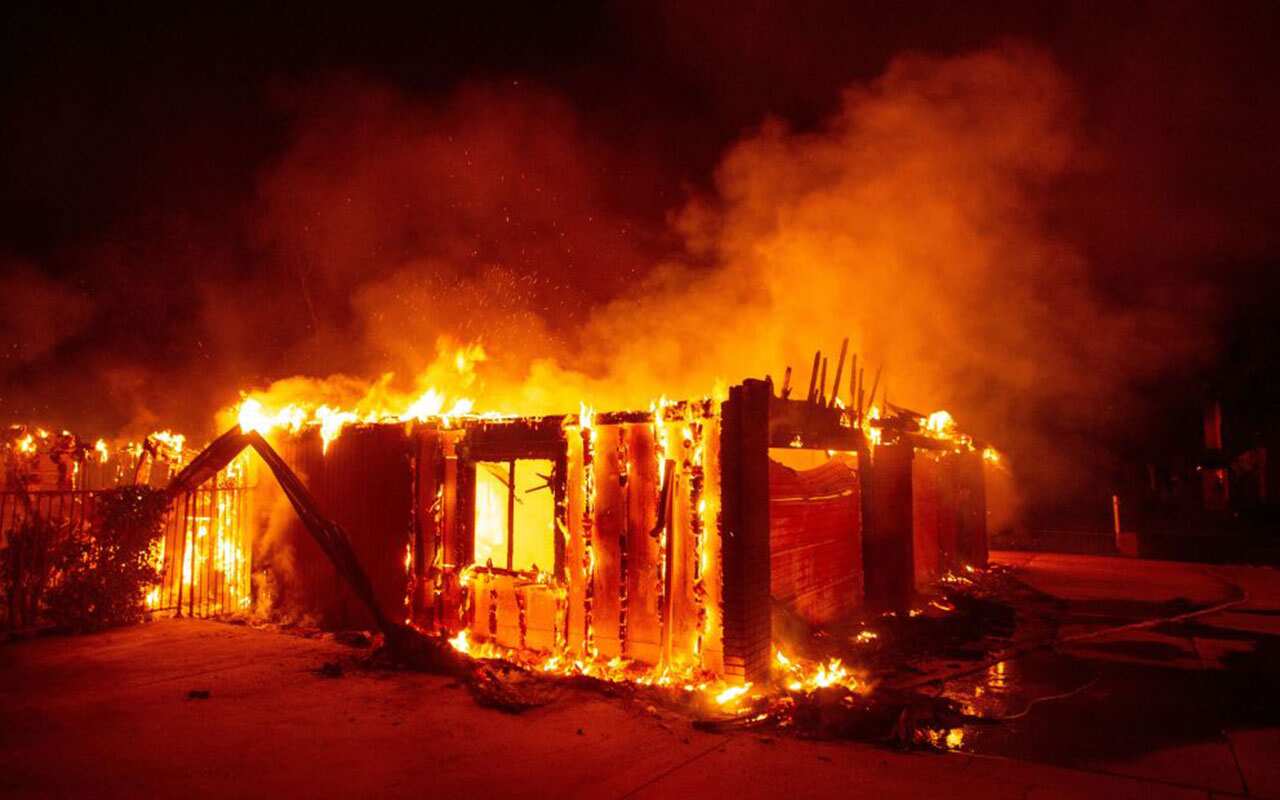 A house burns during the Carr fire in Redding, California on July 27, 2018