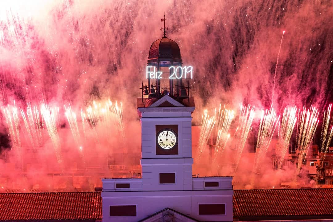 The clock at Spain's Puerta del Sol rings at midnight.