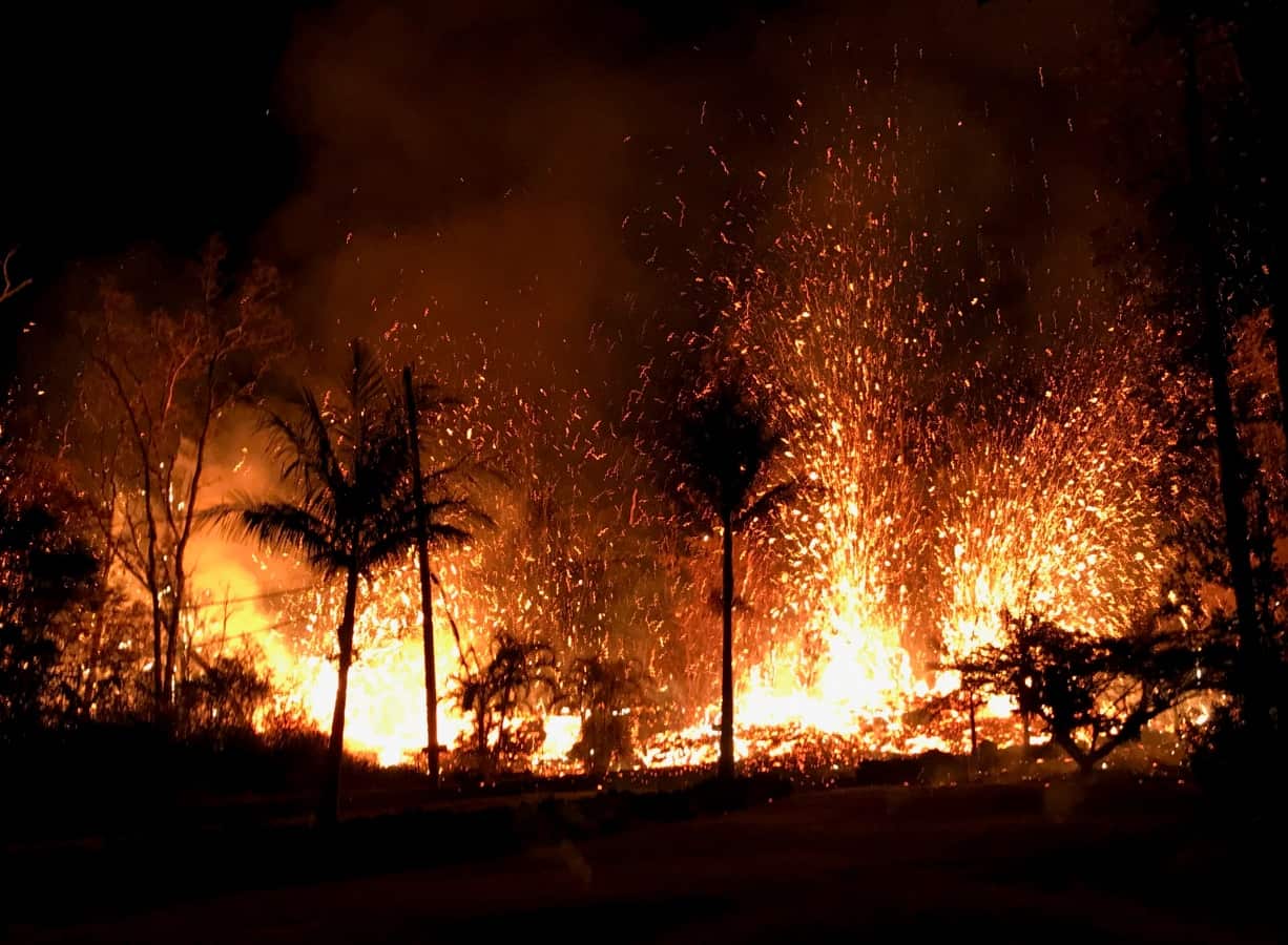 A handout photo made available by the United States Geological Survey shows a new fissure erupting from Luana Street, Leilani Estates