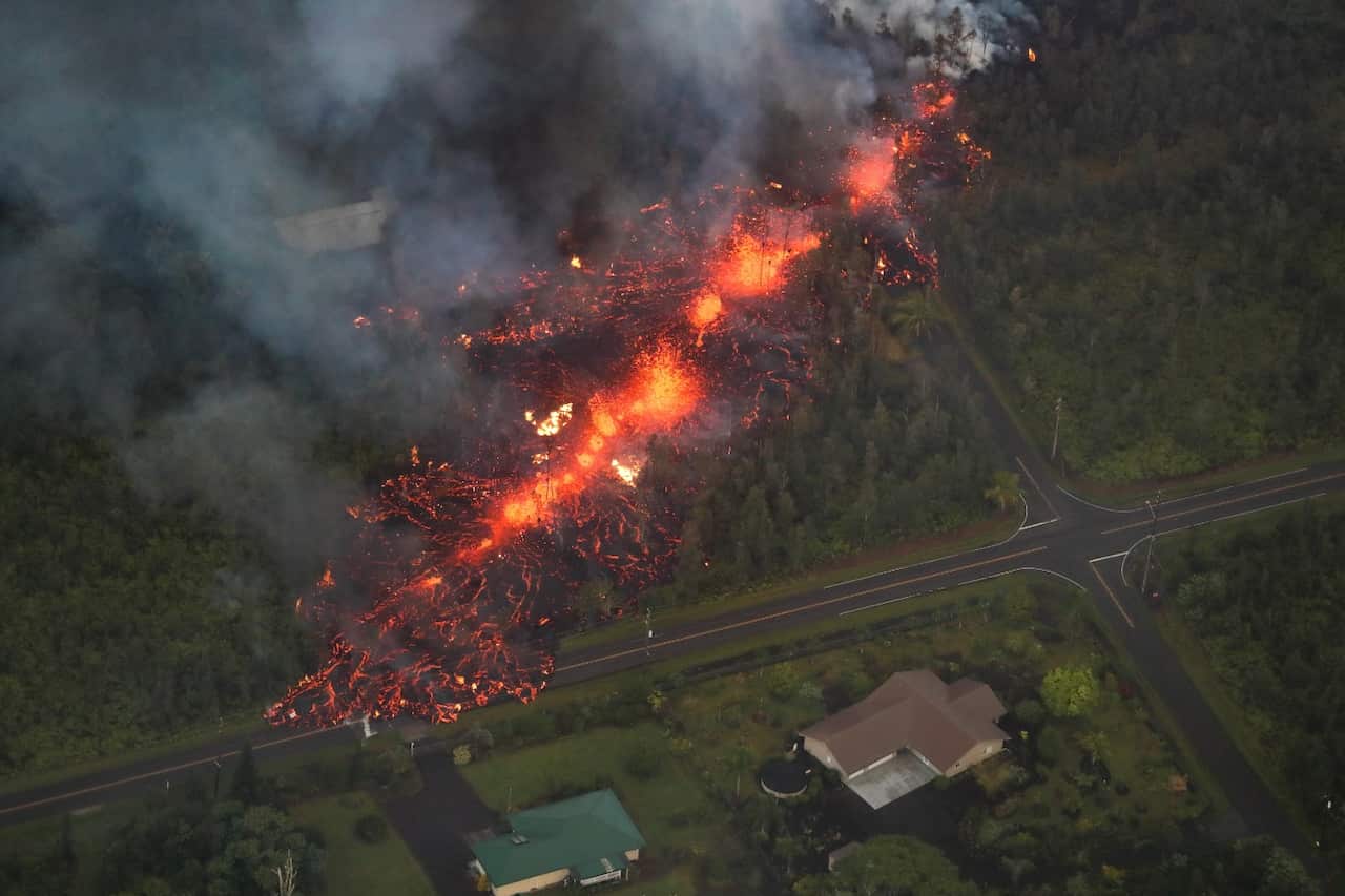 A 2,000 foot long fissure erupts within the Leilani Estates subdivision, on the east rift zone of the Kilauea volcano threatening homes of hundreds