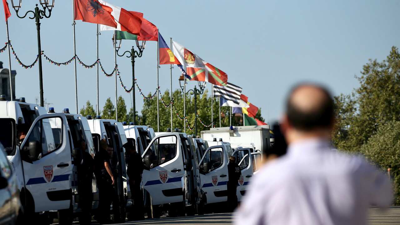 Vehicles of French police in line on a bridge in Bayonne, near Biarritz, France.