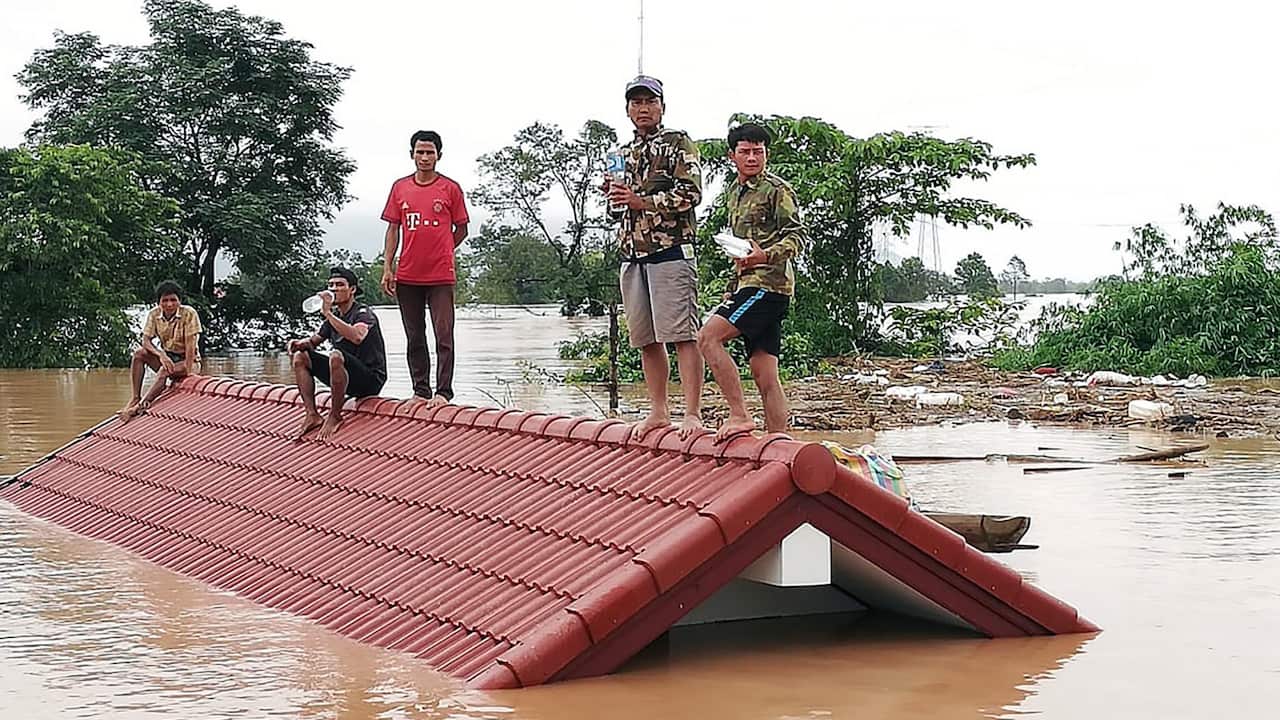 Villagers after the dam collapse.