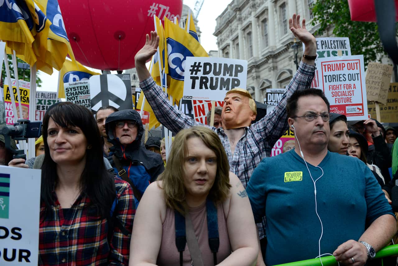 US President Trump called the protests 'flops', despite thousands gathering to protest his arrival.