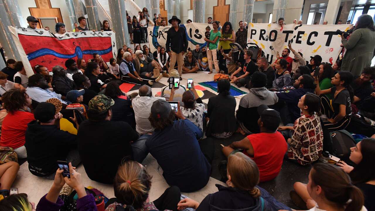 Aboriginal and Torres Strait Islanders protesting in the Marble Foyer at Parliament House in Canberra.