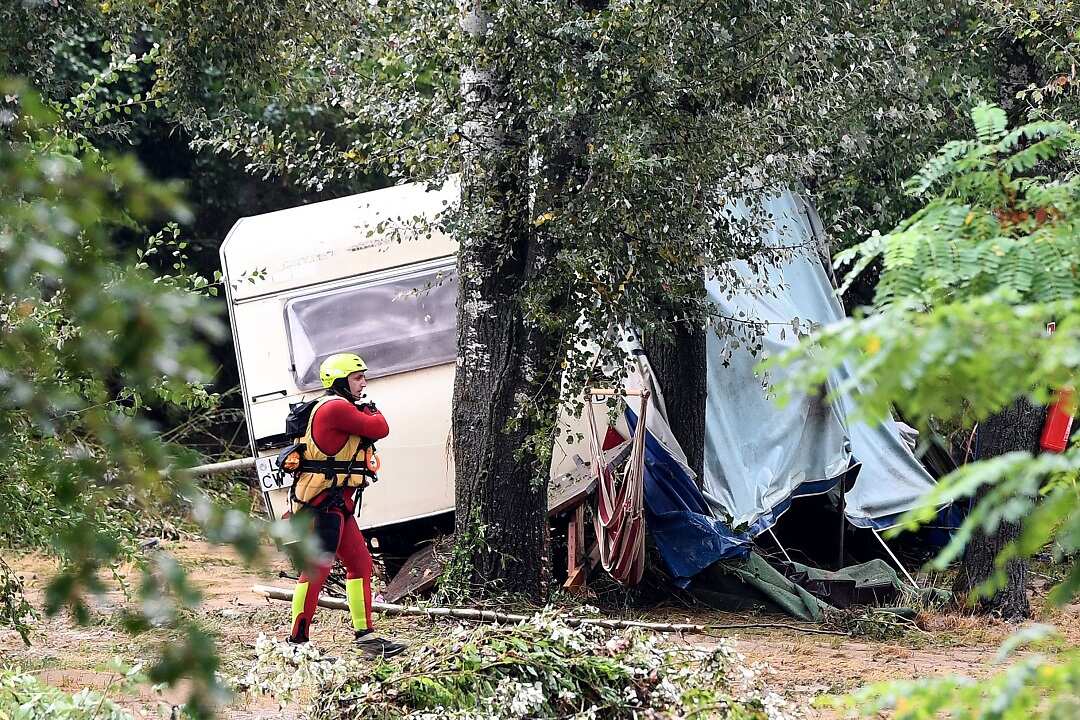 A damaged caravan in a camping as storms and heavy rains sweep across France.