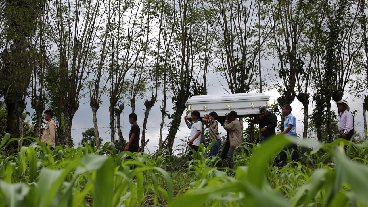Family members and supporters carry the coffin of the minor Jakelin Caal Maquin.