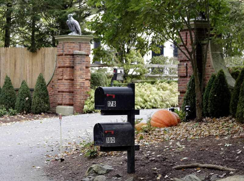 A device found outside the compound "had the components" of a bomb, including explosive powder, a law enforcement official said.